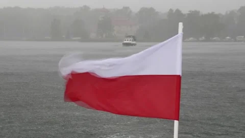Polish Ship Flag Banner Flies on Heavy Wind during Thunderstorm on Lake Stock Footage 229780415