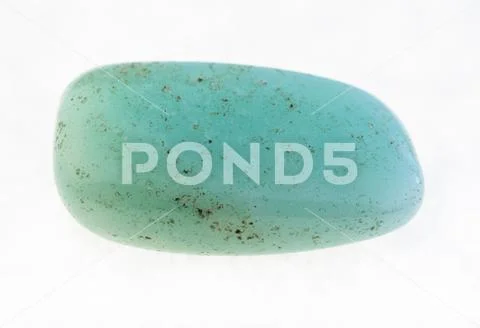 Polished aquamarine (blue beryl) stone on white Stock Photos