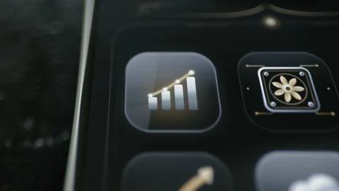 Polished black mobile interface pairs an ascending gold business chart Stock Photos