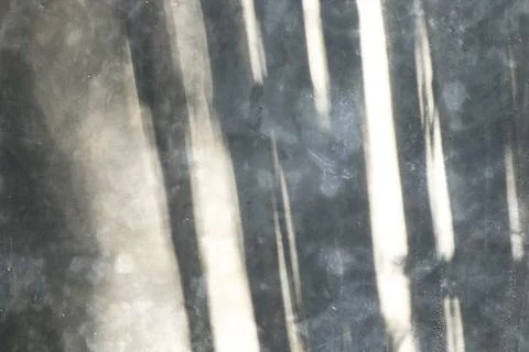 Polished concrete wall texture with vertical light beams, abstract shadows Stock Photos