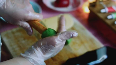 Polished cooking sequence of forming a red crown around a small wooden support Stock Footage 342155643