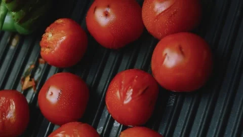 Polished culinary view of close detail of charred tomatoes Stock Footage 342152682