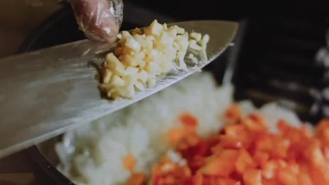 Polished culinary workflow: slicing onion and bell pepper Stock Footage 342199444