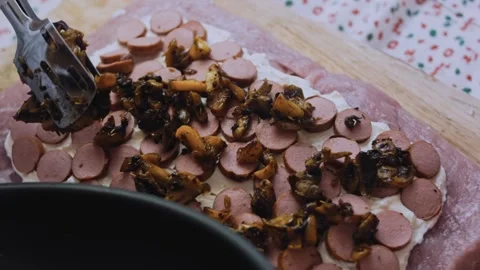 Polished dynamic preparation: slicing cooked sausage into rounds Stock Footage 342184592