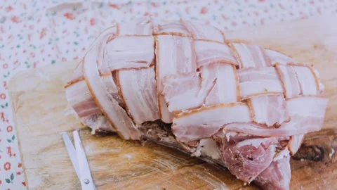 Polished finished dish: securing a bacon wrapped tenderloin Stock Footage 342184786