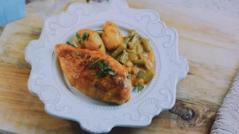 Polished fresh assembly: serving honey mustard chicken with roasted vegetables Stock Footage 342180827