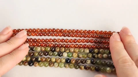 Polished garnet gemstone bead strands for artisan jewelry design Stock Footage 345139886