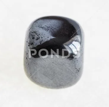 Polished hematite (haematite) gem stone on white Stock Photos