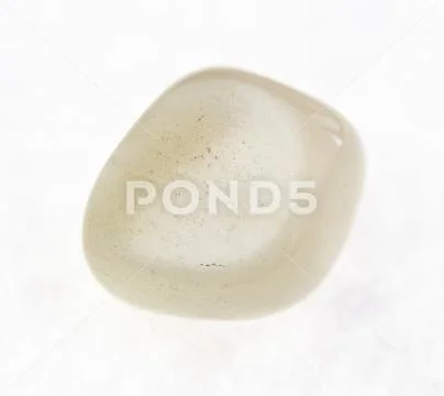 Polished moonstone (adularia) gemstone on white Stock Photos