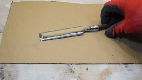 The polished part of the old chisel. Restoring an old tool. Stock Footage 155884461