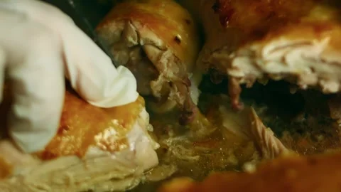 Polished raw whole chicken rubbed with seasoning before roasting in top view, 4K Stock Footage 341105733