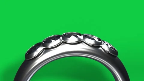 Polished ring sliding and rotating after camera pullback, showing faceted gems, Stock Footage 339198118