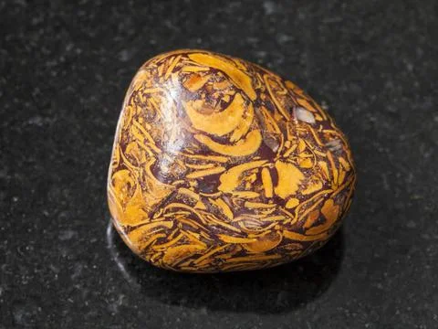 Polished Script stone gemstone on dark macro shooting of natural mineral r... Foto stock