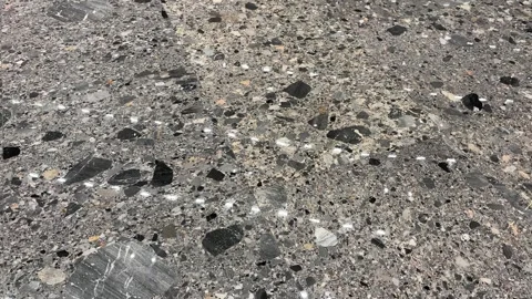 Polished Terrazzo Floor with Embedded Stone Aggregates and light reflection Stock Footage 331555819