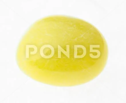 Polished yellow calcite gemstone on white Stock Photos