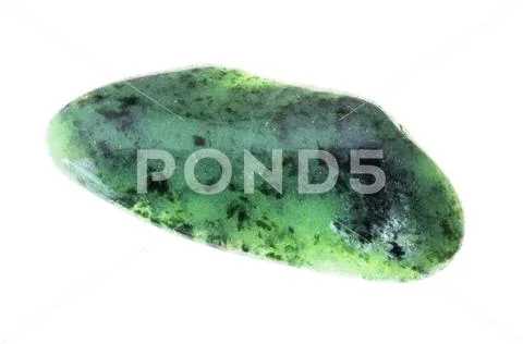 Polished zoisite (saualpite) gem stone on white Stock Photos