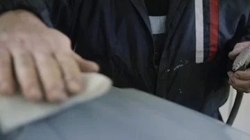 Polishing a car bumper Stock Footage 85899084