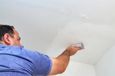 Polishing a ceiling Stock Photos