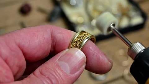 Polishing a gold ring Stock Footage 171387742