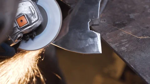 Polishing grinder of the surface of the axe Stock Footage 129040420