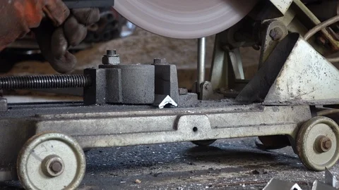 Polishing the iron with a machine with a fire splash. 動画素材 107259890