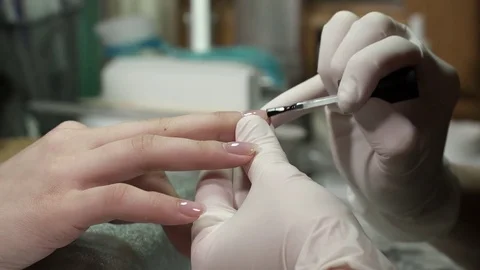 Polishing nails with the base polish Stock Footage 73440658