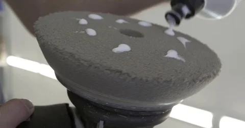 The polishing paste is applied to the polishing wheel Stock Footage 85396231