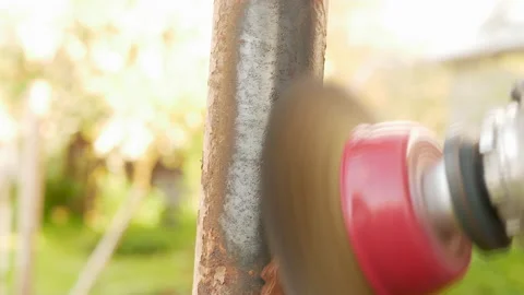 Polishing rusty pipe. using wire brush Stock Footage 154676175