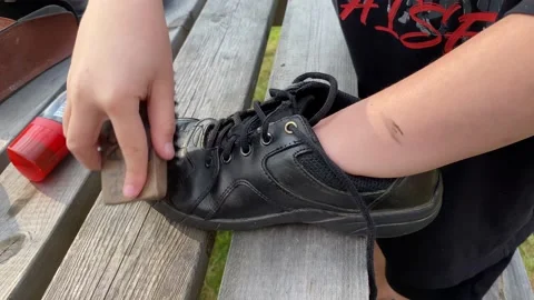Polishing a shoe Stock Footage 185065807
