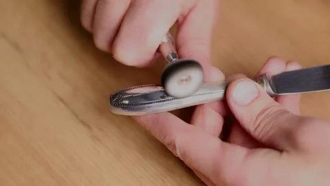 Polishing silverware to restore its shine and beauty at home Stock Footage 322519415