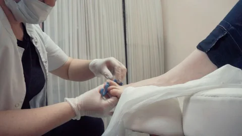 Polishing toe nails Stock Footage 87825353