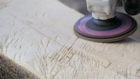 Polishing wood. Processing of logs using a grinding machine. Carpentry work. Car Stock Footage 231239857