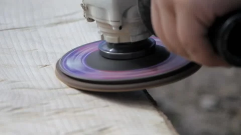 Polishing wood. Processing of logs using a grinding machine. Carpentry work. Car Stock Footage 231804542
