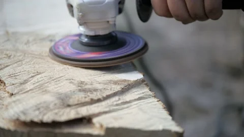 Polishing wood. Processing of logs using a grinding machine. Carpentry work Stock Footage 234907737
