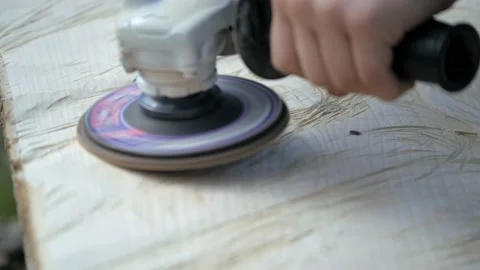 Polishing wood. Processing of logs using a grinding machine. Carpentry work Stock Footage 237184202
