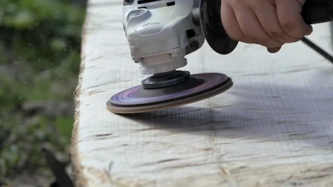 Polishing wood. Processing of logs using a grinding machine. Carpentry work Stock Footage 246823317