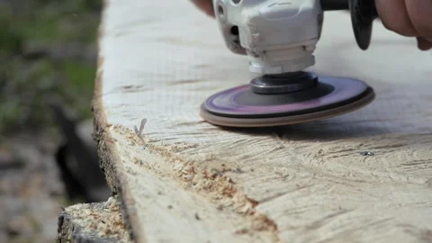Polishing wood. Processing of logs using a grinding machine. Carpentry work Stock Footage 288894752