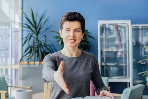 Polite friendly middle aged neutral gender hr manager recruiter posing for Stock Photos