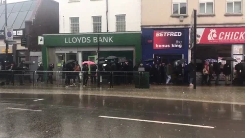 Polite Londoners QUEUE to avoid flood on high street Video stock 106308835