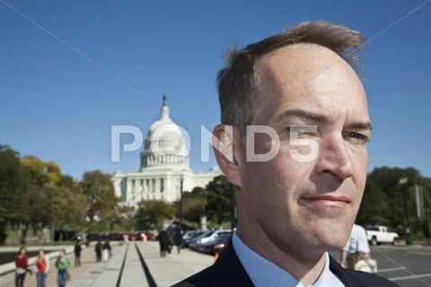 A politician in front of the US Capitol Building Stock Photos
