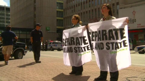 Politics and protest, greenpeace protesters and Calgary tower Stock Footage
