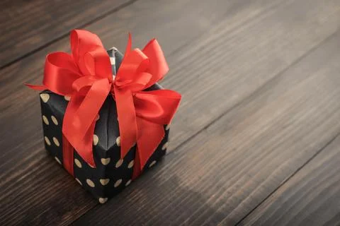 Polka dot Gift box with red ribbon Stock Photos