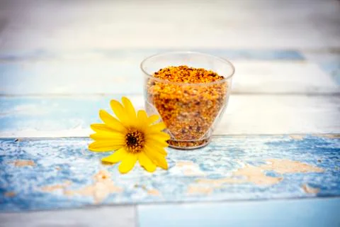 Pollen in plastic glass on the table Stock Photos