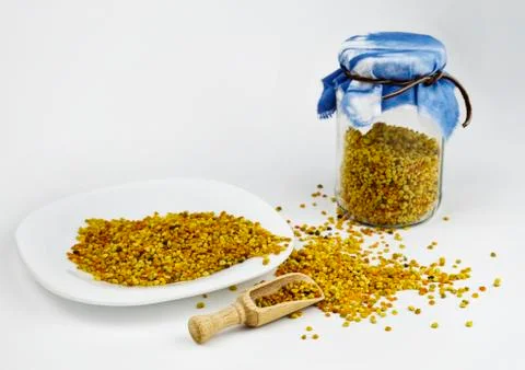 Pollen on the white next to the bottle Stock Photos