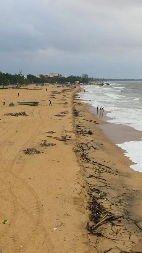 Polluted beach after a storm. Negombo, Sri Lanka. 動画素材 343332878