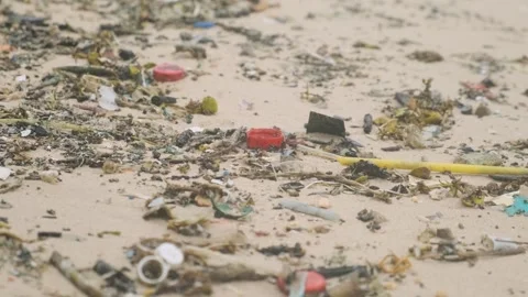 Polluted beach with plastic waste and debris on the sea coast on Phuket island Stock Footage 287350354