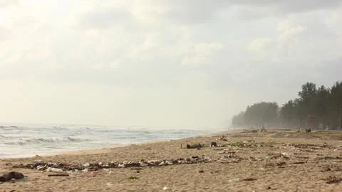 Polluted beach with trash and plastic waste in Southeast Asia Stock Photos