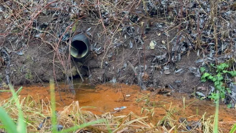 The Polluted Drainage Pipe Is Found in the Natural Environment, Compromising Its Stock Footage 322756015