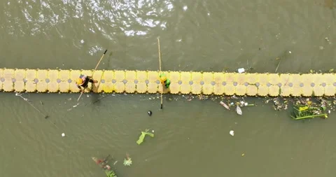 Polluted river with a barrier to trap debris. Indonesia, Jakarta. Stock Footage 239038725