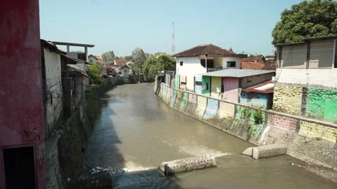 Polluted River Canals Through Settlements In Banyuwangi, East Java, Indonesia Stock Footage 333799334